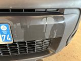 a close up of the front of a car with a license plate on it