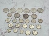 some coins are laying on a marble counter top