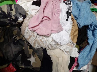 a pile of clothes sitting on top of a pile of clothes