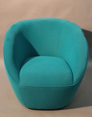 turquoise swivel chair in the shape of a ball