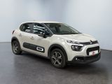 a white citrole is parked in a white room