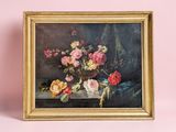 a picture of a painting of flowers in a gold frame