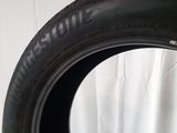 a close up of a tire on a white surface with a white background