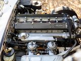 a close up view of a car engine with its hood open