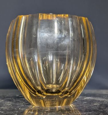 a glass vase that is sitting on a table