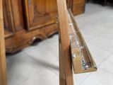 a pair of skis sitting on a wooden stand