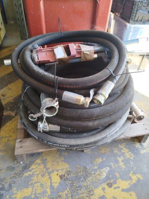 a pile of hoses sitting on top of a pallet