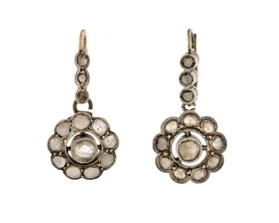 an image of a pair of silver earrings with white stones
