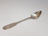 silver spoon with a diamond on it sitting on a white surface