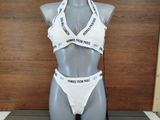 a mannequin wearing a white bra and panties on display