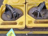 two yellow trays that are sitting on a table
