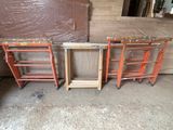 three wooden ladders sitting next to each other in a room