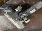 a close up of a clamp on a piece of metal