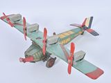 a toy airplane that is flying in the sky