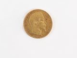 a gold coin with a picture of a man on it