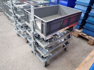 many containers stacked on top of each other on the pallets
