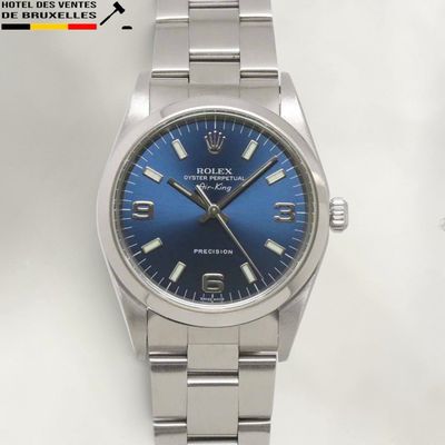 rolex oyster blue dial watch on a stainless steel bracelet