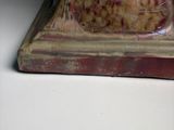 a figurine of a cat sitting on top of a table