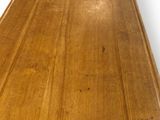 a close up of a wooden table with a white background