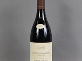 a bottle of wine that is sitting on a table