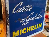 a blue and yellow sign sitting on a wooden table