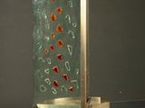 a sculpture of a glass and metal structure in the middle of a room