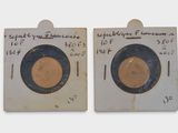 pair of antique brass plates with black rims and writing on them
