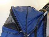 a blue stroller with a black handlebar attached to it