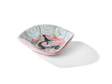 petit bol rose et bleu orné d'un oiseau sur fond blanc