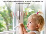 a little girl that is looking out of a window