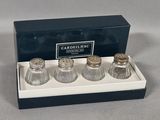 three salt and pepper shakers in a box