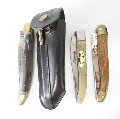 several different types of knives are lined up on a white surface