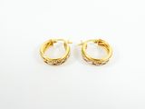 a pair of gold hoop earrings on a white background