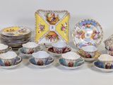 many plates and cups that are sitting on a table