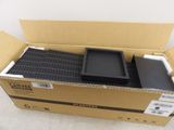 a box that has a computer in it on the floor