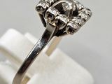 an image of a diamond ring on a stand