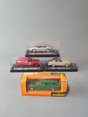 four different models of cars in a display case