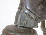 a close up view of a fire hydrant with a hose attached to it