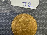 a close up of a gold coin with a tag on it