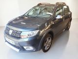 a picture of a grey dacia parked in a white room