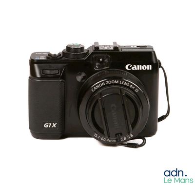 a camera that is sitting on a white surface