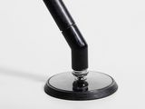 an image of a black and white photo of a desk lamp