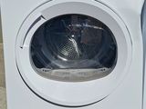an image of a washing machine sitting on the ground