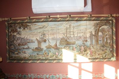 a picture of a tapestry hanging on the wall in a room