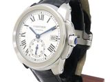 a silver wrist watch with a black leather strap
