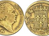 a gold sovereign coin with a crown on top of it