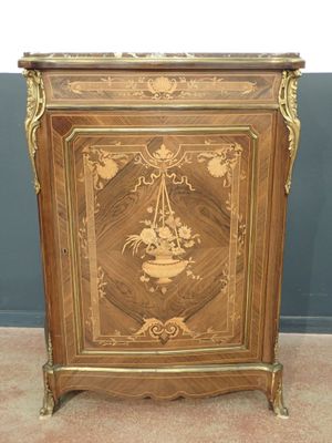 a small cabinet that has a design on it