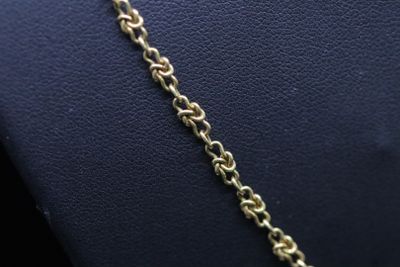 a close up of a gold chain on a mannequin mannequin mannequin mannequin mannequin mannequin mannequin manne