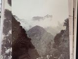 a picture of a picture of a mountain with a horse in it