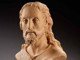 a marble bust of a man with long hair and beard